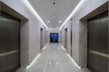 Corridor with elevators doors in City Tower of international business complex.