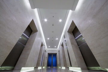 Passage with elevators doors on both sides in City Tower of  international business complex.