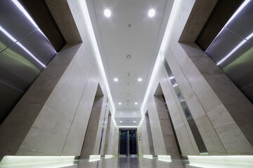 Corridor with elevators doors on both sides in City Tower of  international business complex.