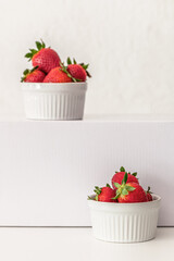 ripe sweet fragrant strawberries in white bowls