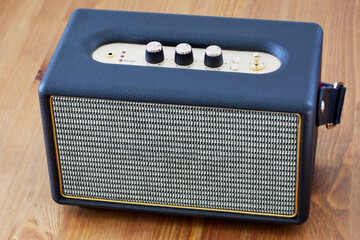 Mobile sound speaker on table.