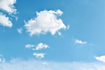 Blue sky with white fluffy cloud. Cumulus clouds background. Beautiful sky in the morning. Cloudscape backdrop. Summer spring autumn winter sky. Freedom of life concept. 