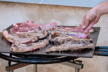 T-bone steaks cooking on the grill