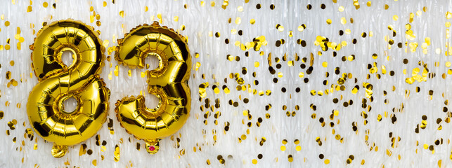 Gold foil balloon number, digit eighty-three. Birthday greeting card with inscription 83....