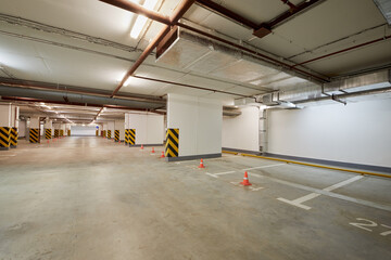 Empty indoor underground parking space.