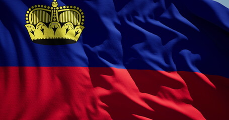 Close-up of the national flag of principality of Liechtenstein flutters in the wind on a sunny day
