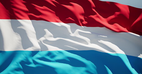 Close-up of the national flag of Grand Duchy of Luxembourg flutters in the wind on a sunny day