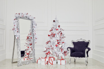 Interior of white room decorated to Christmas holidays.