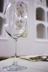 Empty wineglass on table in cafe.