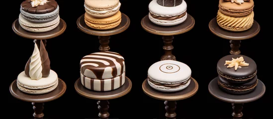 Poster 3D rendering of a variety of chocolate and vanilla macarons on podiums against a black background. © slawatchisherazad