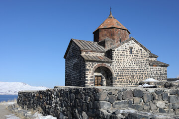 Fototapeta na wymiar Surb Arakelots Church is ancient architectural monument of Armenia, 9th century, winter