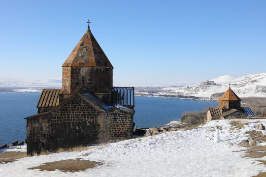 Lake Sevan, Surb Arakelots Church is ancient architectural monument of Armenia, 9th century, winter, town far away