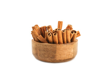Cinnamon sticks in a bowl isolated on a white background. Cinnamon roll. Spicy spice for baking, desserts and drinks. Fragrant ground cinnamon.