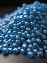 Fototapeta premium Close Up Of A Two Stacks Of Blue Plastic Polypropylene Granules On A Table