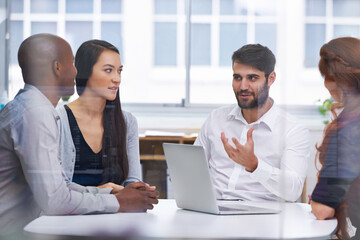 Meeting, business people and planning in conference room for discussion, collaboration or idea. Office, laptop and diverse group of employees together for teamwork, review or staff on project