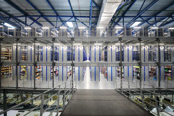 Large warehouse with many shelves with goods - hall in sorting center