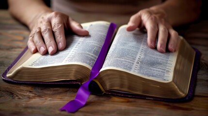 Naklejka premium Spiritual Enlightenment: Hands Embracing the Holy Bible with a Purple Ribbon 