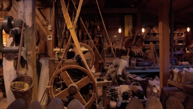 Zaanse Schans, Netherlands, March 29 2023: Vintage machine tools in small workshop producing klompen (clogs) - famous traditional dutch footwear made completely from wood