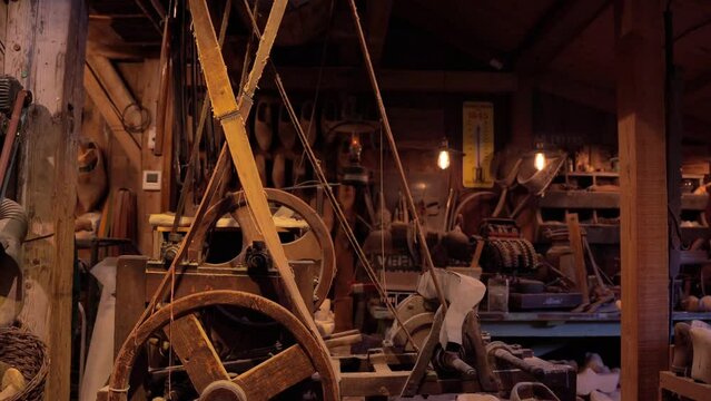 Zaanse Schans, Netherlands, March 29 2023: Vintage machine tools in small workshop producing klompen (clogs) - famous traditional dutch footwear made completely from wood