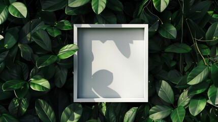 Frame square white mock-up on green leaves background