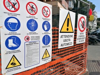 Rome, Italy - January 29, 2024, barriers with signs for forced passage near a construction site.
