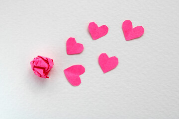 Paper hearts freeing themselves from complicated emotions