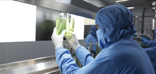 man doing visual inspection, chemical liquid sanitiser gel in bottles aqueous soap hand wash...