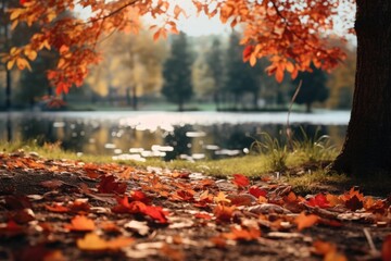 Fallen leaves scattered on the ground by the water, ideal for nature and autumn themed projects