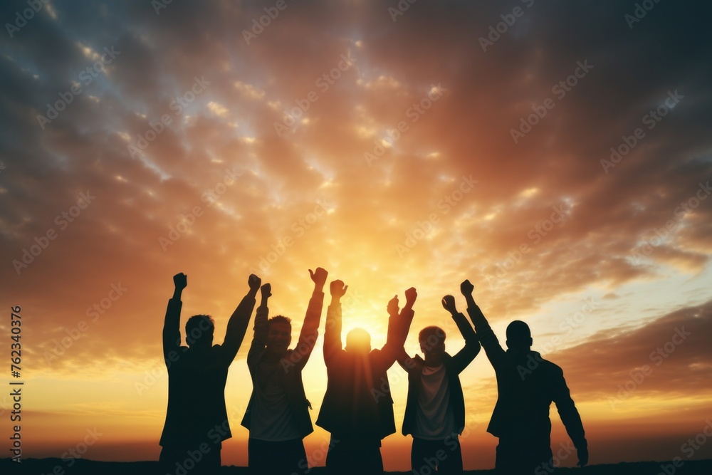 Poster A group of people raising their hands in the air. Suitable for team building concept