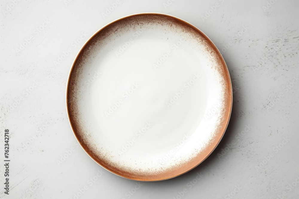 Poster a simple white plate with a brown rim on a table. suitable for food and dining concepts
