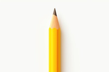 Close-up of a yellow pencil on a white surface. Ideal for educational and office themes