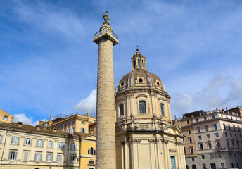 Fototapeta na wymiar Column of Trajan and Church of the Holy Name of Mary at Trajan's Forum in Rome, Italy 