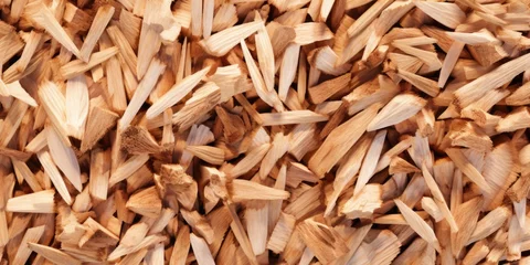 Fotobehang A detailed view of a pile of wood chips, ideal for background or texture use © Fotograf