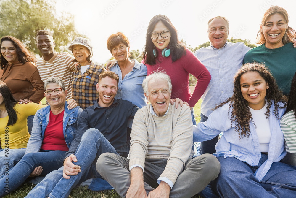 Wall mural group of multigenerational people smiling in front of camera - multiracial friends of different ages