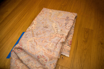 transformation with a new carpet laid gracefully on the parquet floor, marking the renovation of the house and enhancing floor heating for added comfort and warmth.