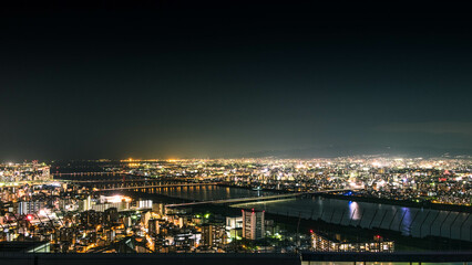 Fototapeta na wymiar Osaka cityscape at night from the observation platform at the Umeda sky building.