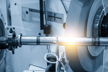 The cylindrical grinding machine in the light blue scene with lighting effect. - obrazy, fototapety, plakaty