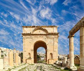 Fototapeta na wymiar Roman ruins (against the background of a beautiful sky with clouds) in the Jordanian city of Jerash (Gerasa of Antiquity), capital and largest city of Jerash Governorate, Jordan