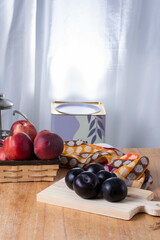 Group of white peaches and plums.