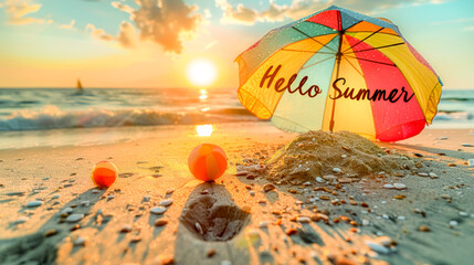 Hello Summer text on a colorful beach umbrella during a vibrant sunset