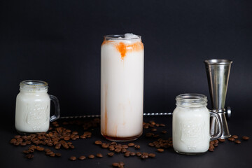 Three glasses of milkshake with assorted flavors. Chocolate, vanilla and strawberry milkshake.