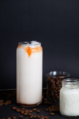 Three glasses of milkshake with assorted flavors. Chocolate, vanilla and strawberry milkshake.