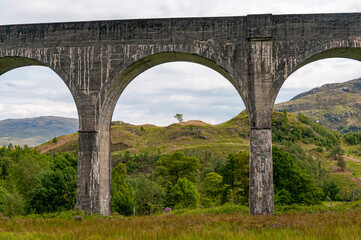 Fototapeta na wymiar Scotland, UK. Mountain landscape . View of the railway viaduct.