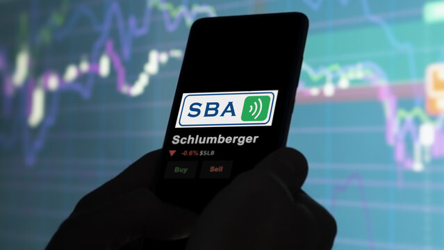 January 15th 2024. The logo of Schlumberger on the screen of an exchange. Schlumberger price stocks, $SLB on a device.