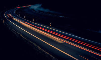lights of cars driving at night. long exposure