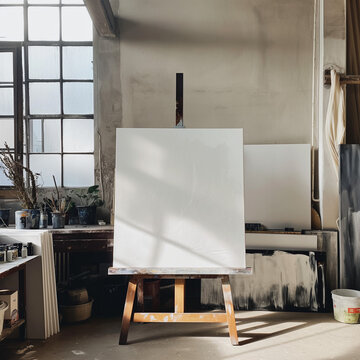 Blank Canvas in Art Studio, Spacious Workspace with Natural Light with Copy Space
