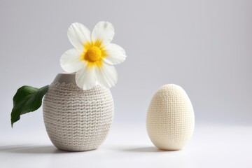 Knitted egg on a pastel background