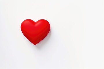 Fototapeta premium A red heart on white background with copy space, Valentine's day and love concept