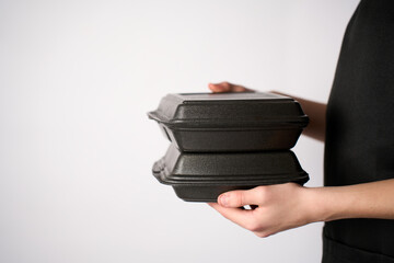 Male Chef holding lunch box with food in the hand