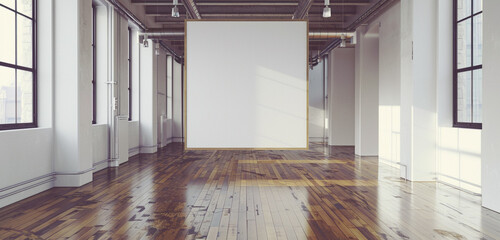 A contemporary art space with polished wooden floors and white walls, featuring a blank poster awaiting creative inspiration